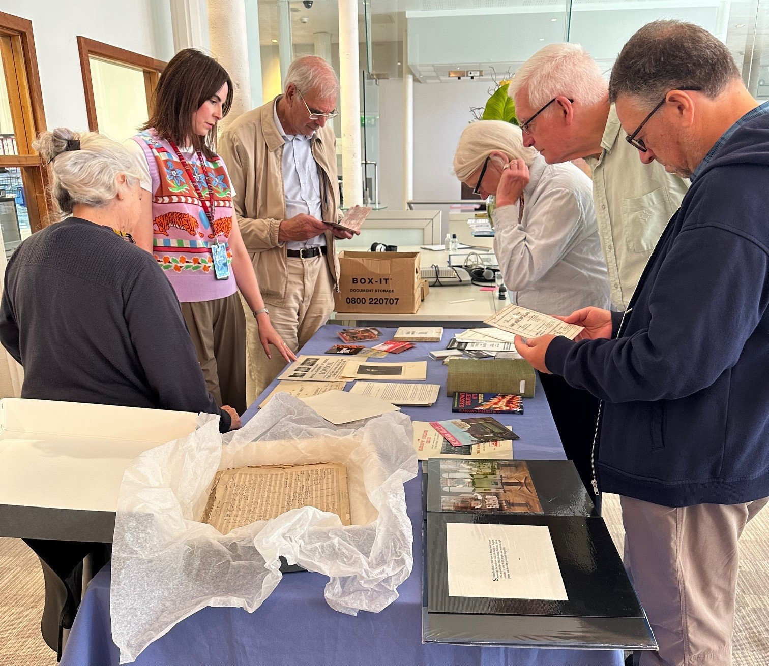 Scottish Music Centre Archives Manager, Tracey McNamara (second from left), points out some treasures from the collection