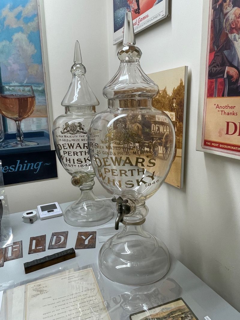 Two Victorian glass bar top whisky decanters. The rare example in the foreground, complete with its original tap, was recently acquired by the Archives